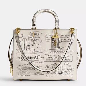 Coach X Peanuts Rogue Bag With Snoopy and Newspaper Print
